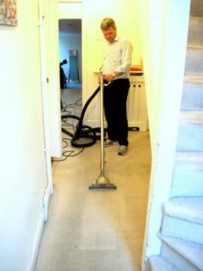 Cleaning a dirty hallway carpet